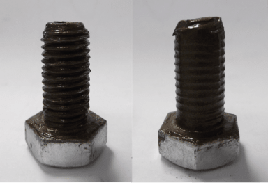 Two bolts coated in anti-seize compound
