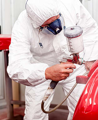 Painting a car in an automotive factory paint shop
